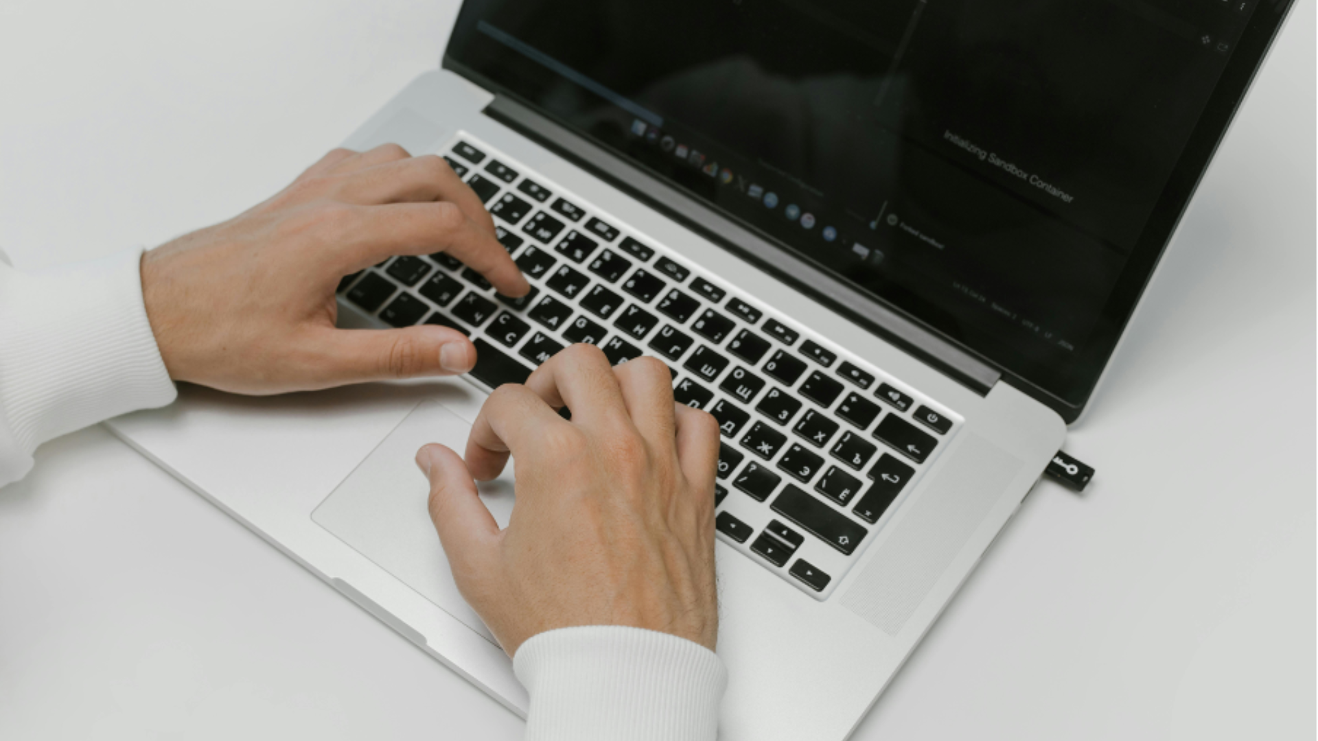 hands resting on a laptop keyboard