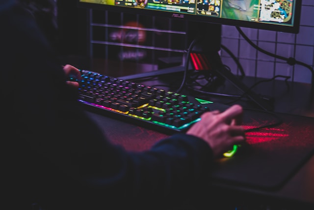 PC gamer using LED keyboard