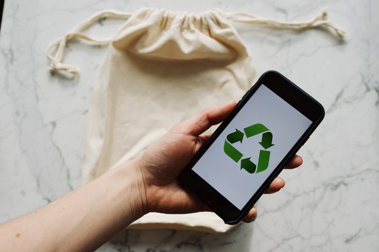 phone with recycle icon on screen