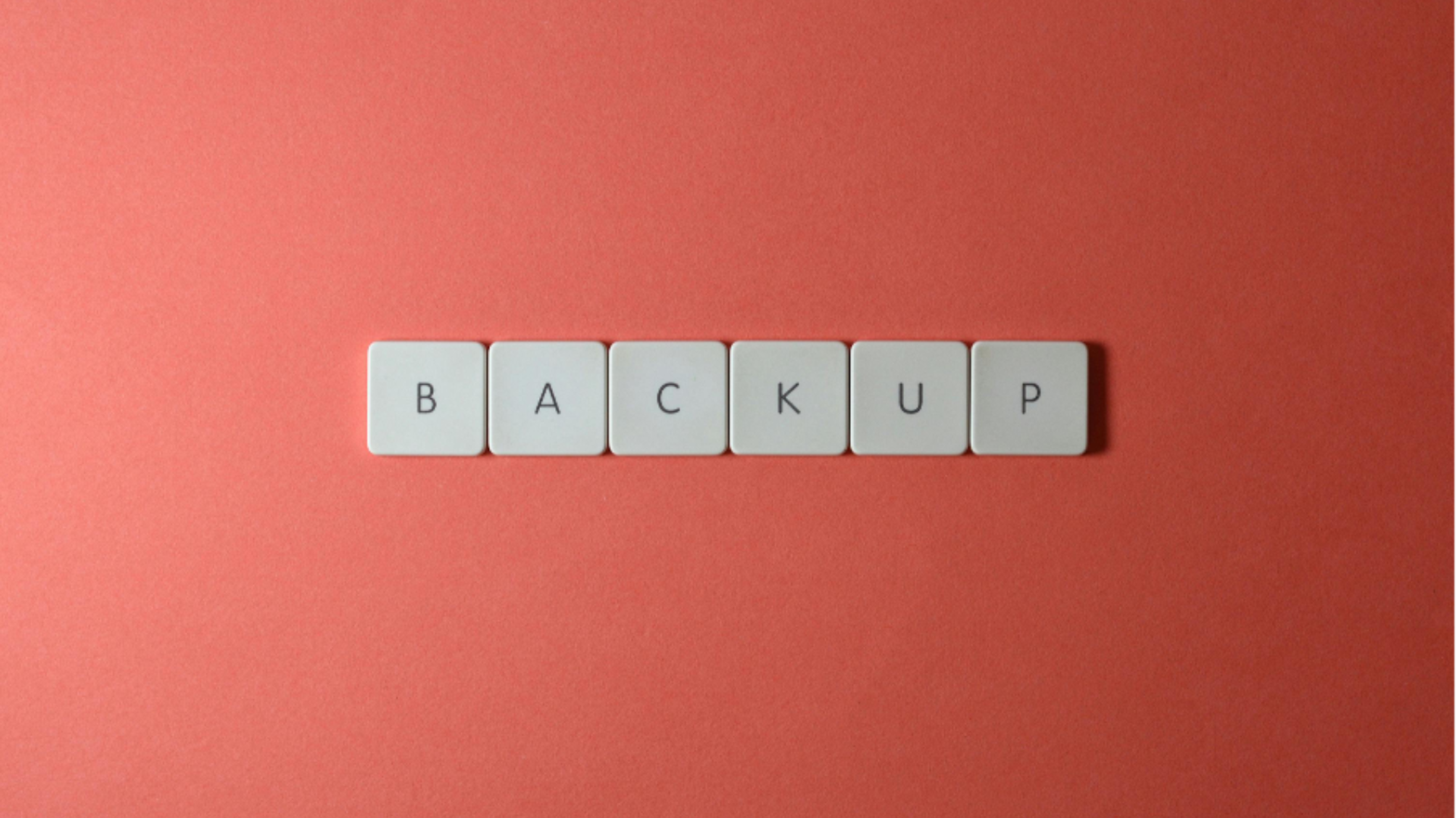 backup spelled in small tiles