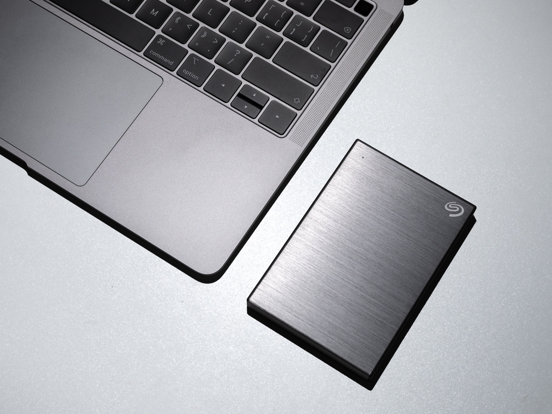 External hard drive next to an macbook